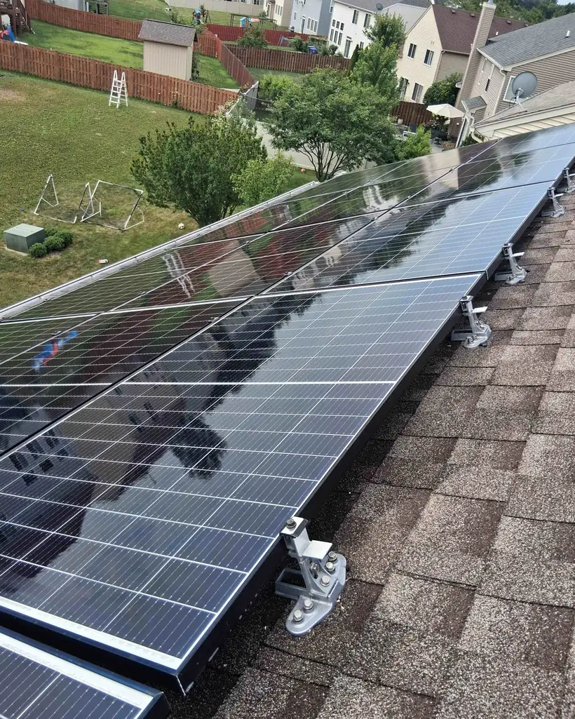 A rooftop solar array left mirror-clean after a purified-water clean